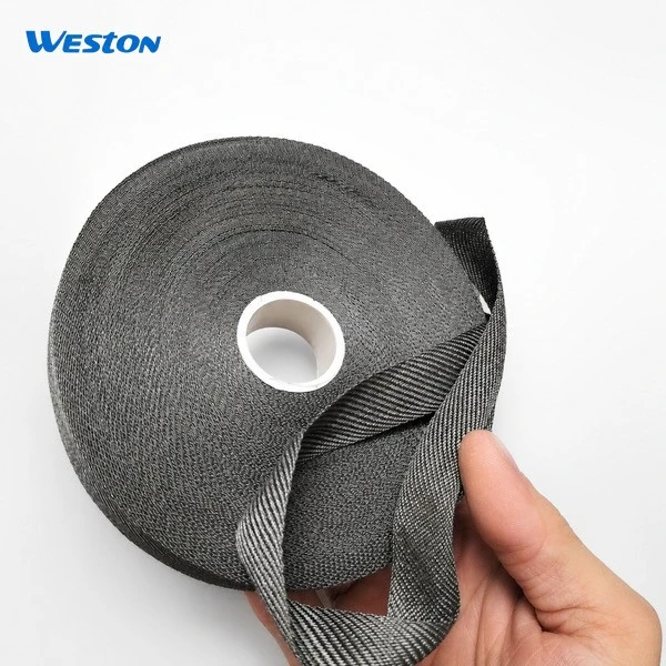 A hand is holding Weston's Metal Fiber Cleanroom Wipes